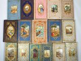 a lot of books with pictures on them on a table