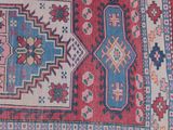 a close up of a rug on a floor with a white background