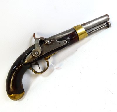 a close up of a gun that is on a white surface