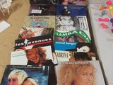 a lot of dvds on the table next to each other
