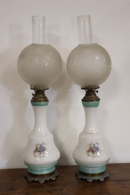 two lamps that are sitting on a wooden table