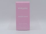 a close up of a pink box of perfume on a white surface