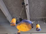 a chandelier hanging from the ceiling of a restaurant