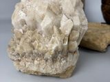 a piece of rock and a piece of wood on a table