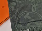 an orange box with a green scarf on top of it next to a green scarf