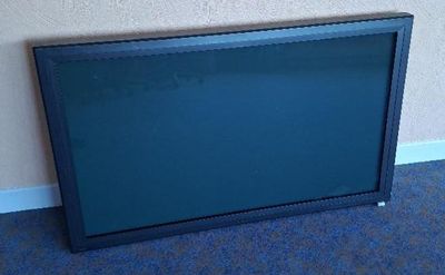 a television that is sitting on the floor in the room