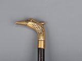 an old walking stick with a bird head on top of it