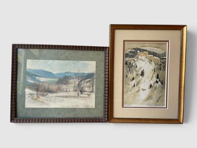 two framed pictures of a snowy landscape and a painting of a mountain scene