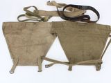 an image of a pair of leather holsters on a white surface