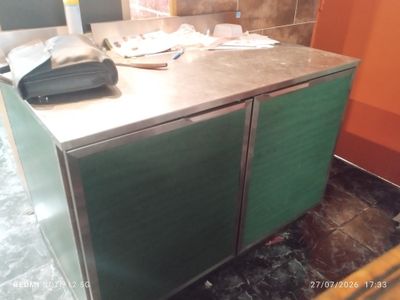 an image of a kitchen counter with a phone on it