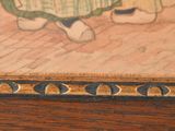 a picture of a painting of a child on a table