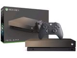 Une console Xbox One et une manette devant un carton ouvert
