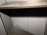 a shelf that has a shelf on top of it
