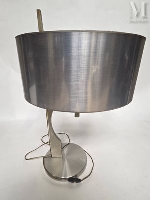 an image of a table lamp with a metal base and a silver shade