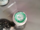 a close up of a bottle of wine on a table