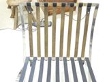 a metal chair with a striped seat and back