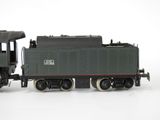 a toy train that is sitting on a white surface