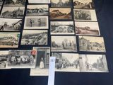 a lot of old black and white pictures on the table