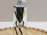 an image of a bottle of body wash sitting on a basket