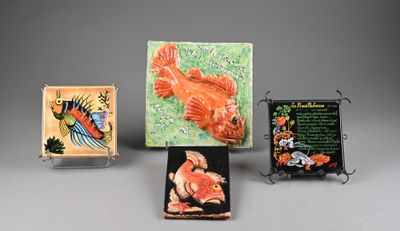 four different pieces of art are displayed on a gray surface