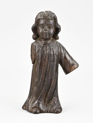 a bronze statue of a child with a robe on