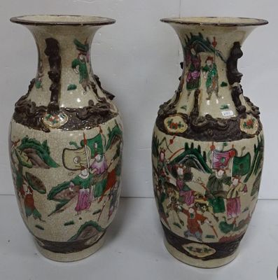 two vases that are sitting next to each other on a table