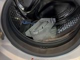 a washing machine that is sitting on the floor