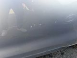 a person sitting in the back seat of a car