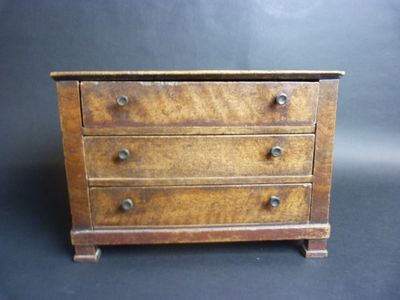 an old wooden chest of drawers on a black background