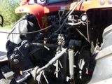 a tractor that is parked on the side of the road
