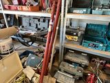 a garage with a lot of tools and tools on the shelves