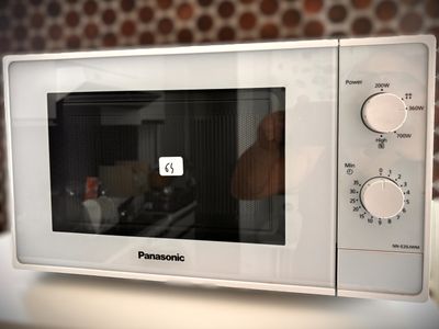 a microwave that is sitting on a counter in a kitchen