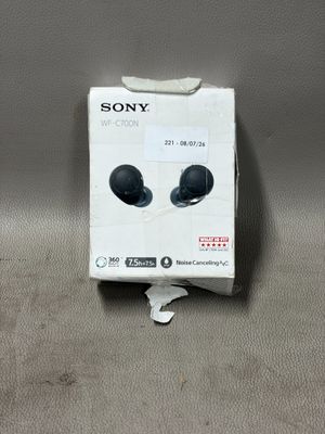 Les écouteurs Sony se trouvent dans la boîte posée sur la table.