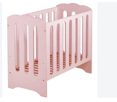 a baby crib with a pink bed and a white background