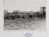 an old black and white photo of a group of people in a field