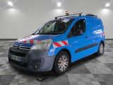 the blue van is parked on a checkered floor in the garage