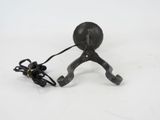 a small metal object with a cord attached to it