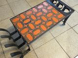 a tray with a design on it sitting on a tiled floor