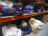 many bags and packages on the shelves in the warehouse
