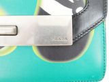 prada green and black wallet with a cat on the front