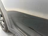 a close up of a car ' s front bumper and fender