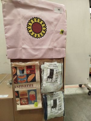 a cardboard box that has a bunch of items on top of it