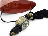 a red box with a black tassel on it