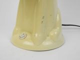 a yellow lamp that is sitting on a table