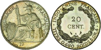 a coin with a woman sitting on top of it