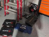 a pile of tools sitting on the floor next to a ladder