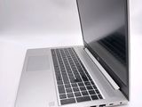 a laptop computer sitting on top of a white table