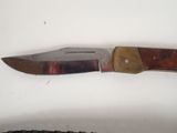 a knife that is laying on a table