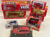 four different types of toy fire trucks in the box