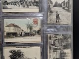 many old postcards on display in a display case